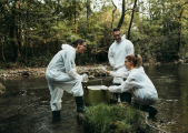 Apem group - unsplash biologists at river